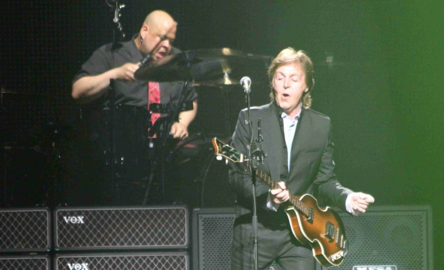 Paul McCartney rocks out on stage during his Out There tour at the Amway Center on Saturday, May 18.