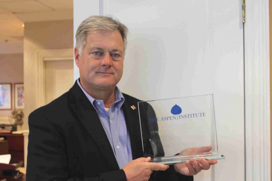 Valencia president, Dr. Sanford Shugart, holds the Aspen Prize Award for Community College Excellence, which was awarded by the Aspen Institute recognizing Valencia as the nation’s best community college in 2011.