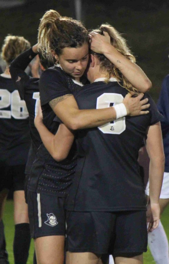 Megan Fish (left) embraces with Kayla Adamek after the Knights loss to FSU in the Sweet 16.