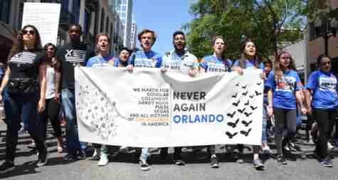 High school students lead a crowd of 25,000  through downtown Orlando to advocate gun regulations.