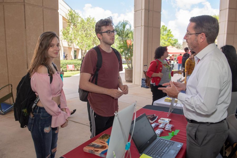 Students speak with Valencia College program advisors and representatives from colleges and universities at the 80s Workout themed Get in Shape to Transfer event on the East campus on April 11, 2019 in Orlando, Fla.