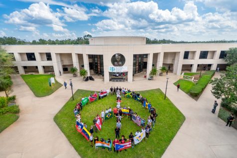 Students Creating A Peace Sign 