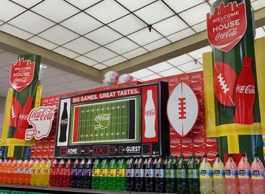 Coca-+Cola+display%E2%80%99s+their+2021+Super+Bowl+advertisement+in+grocery+stores.+