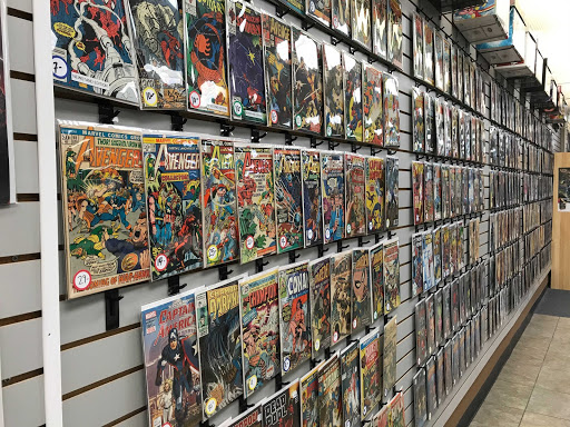 A Wall of Marvel comic books are featured in a comic book store.
