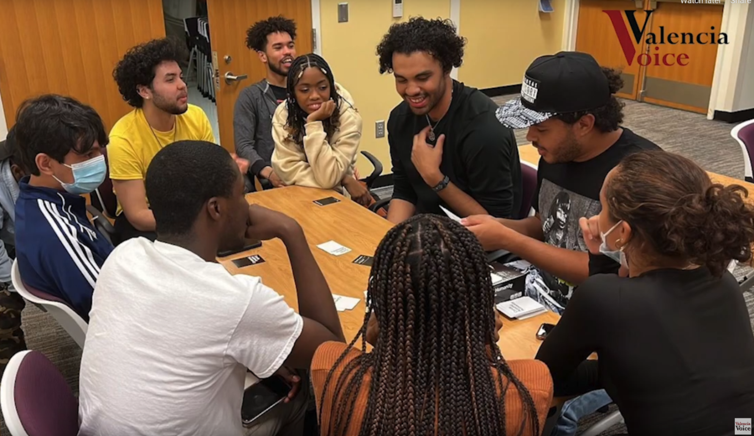 Pop Culture Club members enjoy a card game as a group during one of the clubs weekly meetings. 