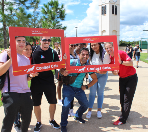 Students pose with Valencia College President Dr. Kathleen Plinske at Osceola Campus clocktower. 