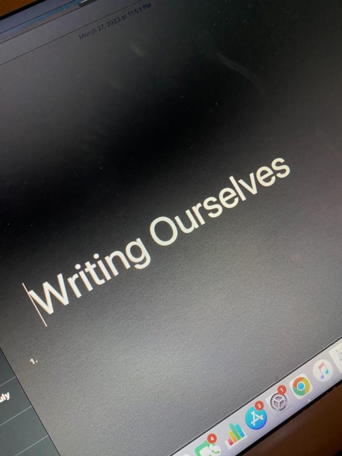 The theme for this years festival is Writing Ourselves. Notepad lettering on black background. 