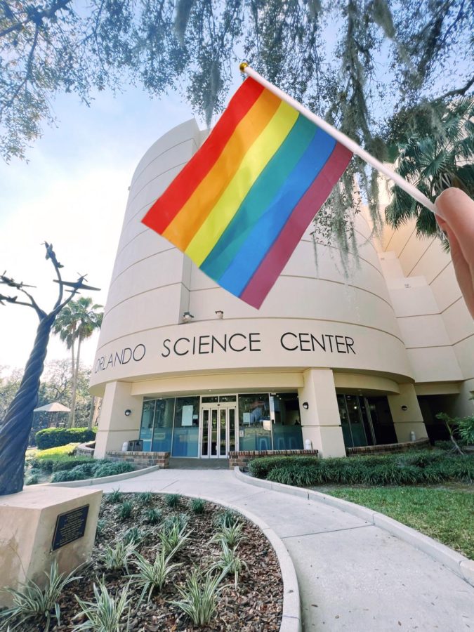 “Pride Flags Outside the Orlando Science Center”,  a flag waves in front of the Orlando Science Center, host of the second Come Out with Pride inclusive prom for LGBTQ+. 
