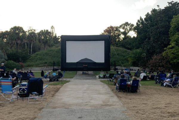 A popup movie theater screen hosts a selection of favorites for guests.