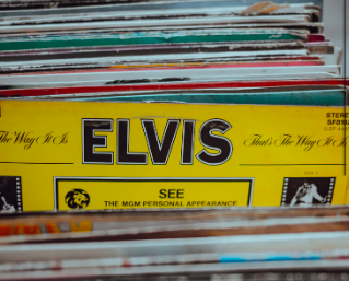 Pictured: An old Elvis Presley vinyl that you can still find in record stores despite how long ago his fame was. However, key details about who Elvis was apart from his legacy were not revealed until his wife Priscilla spoke
out. Even then, his legacy still flourishes. 