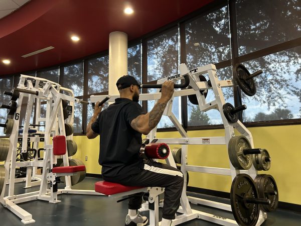 A staff member works out at the East Campus Fitness Center in Building 6.