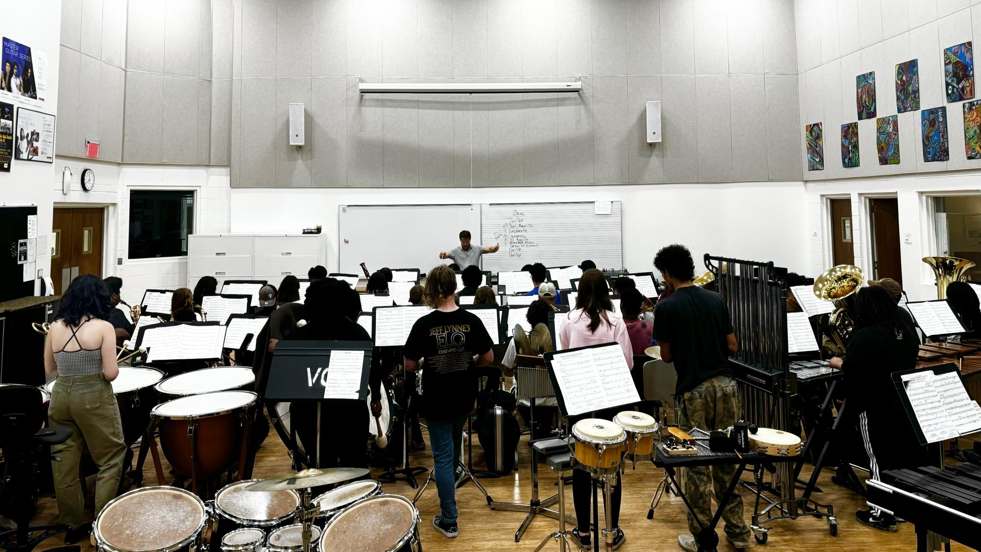 Professor Territo (far center) seen directs Valencia's symphonic band as they practice for the 13th Annual Halloween Concert.
