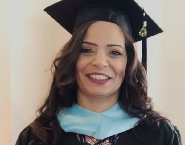 Jisenia Torres at her master's degree graduation, a symbol of her determination, resilience, and commitment to achieving her dreams.  