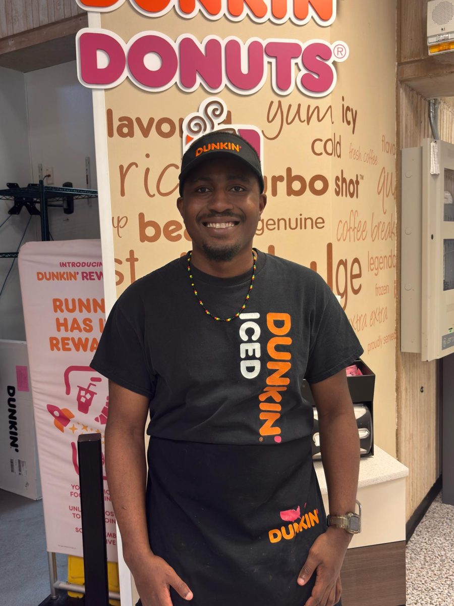 Dunkin Dounuts employee, Jaedon Doly working his last shift on West Campus before their closure on May 30th. 